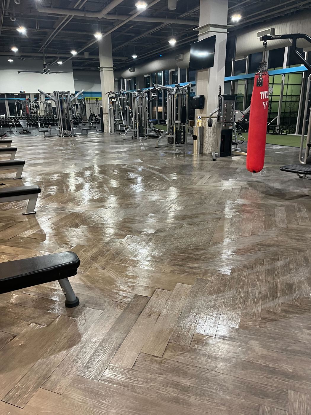 Polished floor across a fitness center gym floor